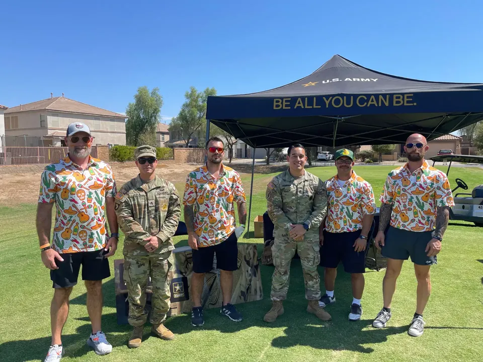 Rich Woyak (far right) at a community golf event