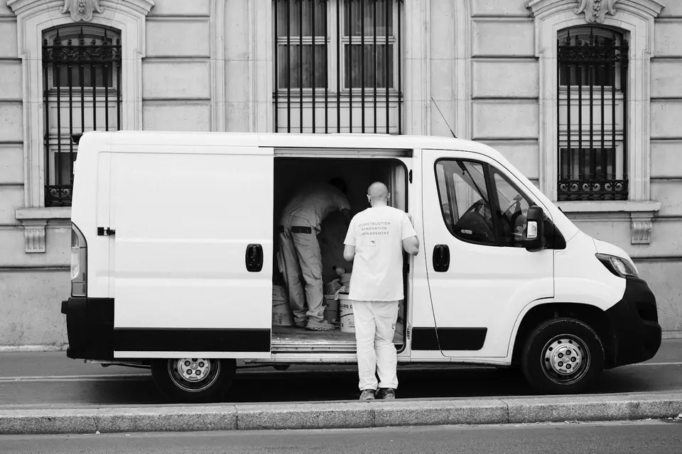 Service technician loading a work van